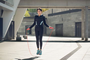 Young woman active exercise workout on street outdoor