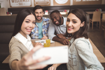 Students in the cafe study together education concept