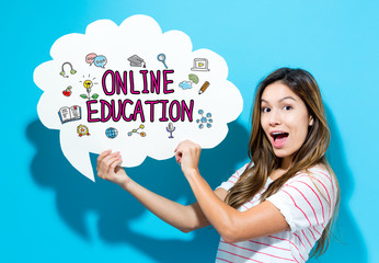 Online Education text with young woman holding a speech bubble on a blue background