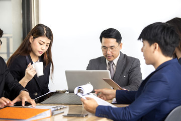 Asian businessman working with team, business teamwork concept, 30-40 year old.