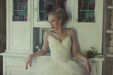 Romantic young bride in vintage interior