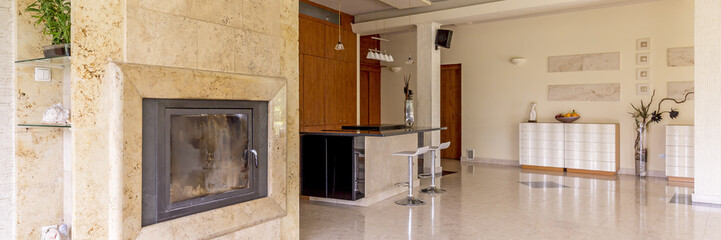 Travertine fireplace in spacious interior