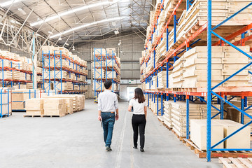The officer checks inventory in the warehouse. 