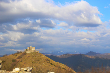 Panoramic view of an old Italian castle on the top of a mountain