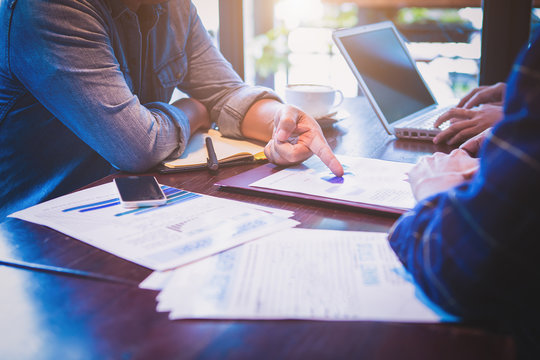 Business People Working With Financial Plan At Office