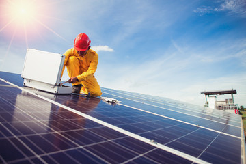 Engineers checking solar panels setup