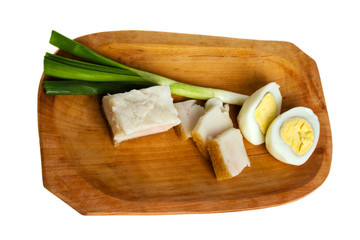 Eggs salo onions on a white background