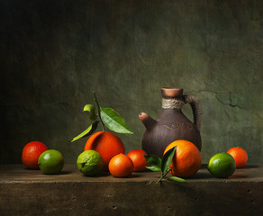 Still life with citrus fruit and jug