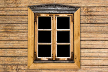 Vintage decorative window in wooden village house cottage.