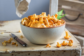Healthy chanterelles on old wooden rustic background