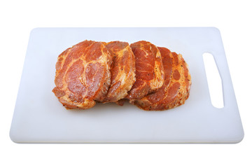 Meat, Pork neck in marinade and on a chopping boardon, on a white background
