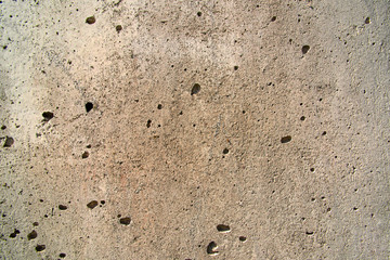 Texture of a cement wall with holes