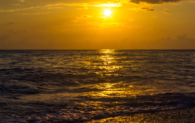 Amazing sea sunset, the sun, waves, clouds