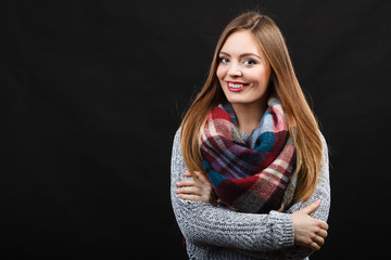 Smiling girl wearing warm wooden scarf