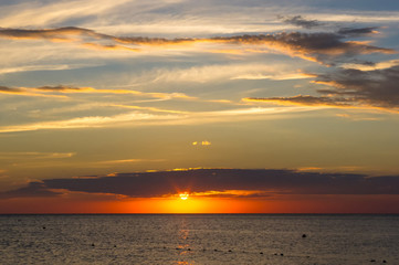 Amazing sea sunset, the sun, waves, clouds