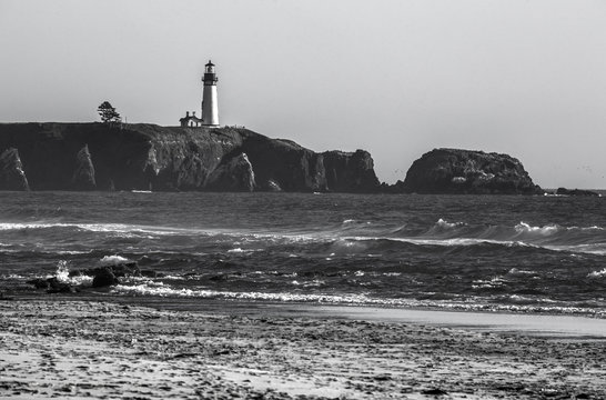 

lighthouse against dramatic sky in black and white