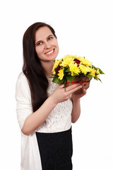 The girl the brunette holds yellow flowers