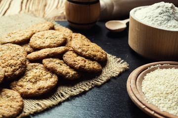 Biscuit sweet cookie background. Domestic stacked butter biscuit pattern concept,close up macro.Homemade cookies on wooden table.Cereal biscuits with the sesame,peanuts,sunflower and amaranth.