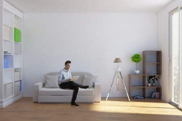 Man using laptop in living room