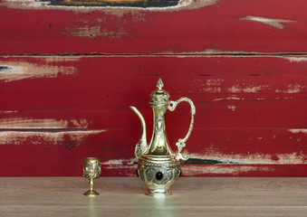 Silver, elegant wine jug and silver wine glass