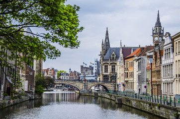 Fototapeta na wymiar Castles palaces churches and bridges surround the canals of ghent