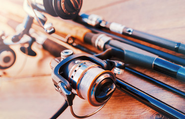 Fishing tackle on a old wooden table. Sport and recreation concept