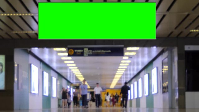 Crowd walking pass blank advertising billboard green screen  in the city, for advertisement, real time and video 4K.