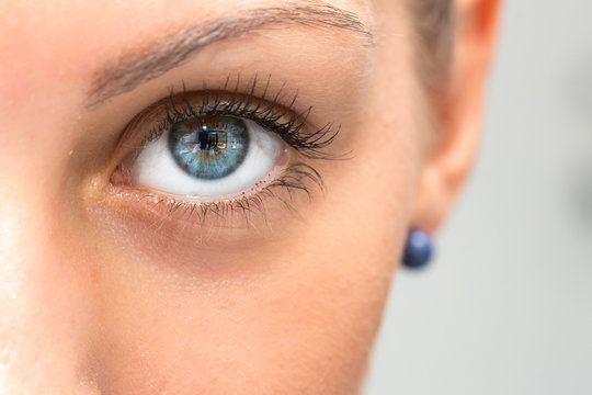 Close up of beautiful blue eye of woman