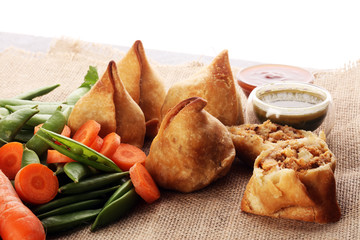 Indian special traditional street food punjabi samosa or Coxinha, Croquete and other Fried Brazilian Snacks - obrazy, fototapety, plakaty
