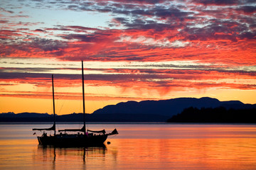 Sailboat at sunset on the west coast of British Columbia 