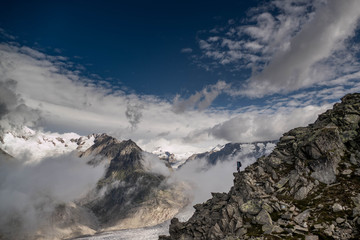 Obraz premium hiker in the swiss alps at a great height near a glacier