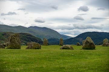 Stone Circle - Druid Circle landscape mountain backdrop clouds
