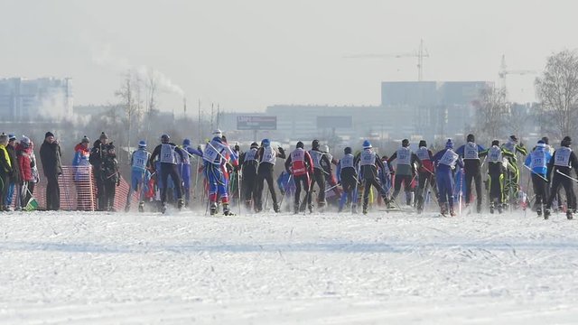 Mass start men athletes skiers during Championship on cross country skiing