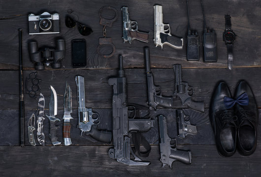 Set of firearms, crime.Binoculars, handcuffs, telephone, walkie-talkie