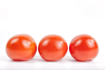 Tomatoes on white background.