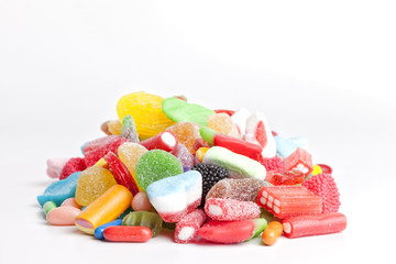 Pile of sweets on white background.