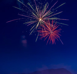 Fototapeta premium Fireworks explode in colorful display Seaside Oregon