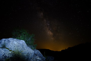 Milky way with rocks in the foreground