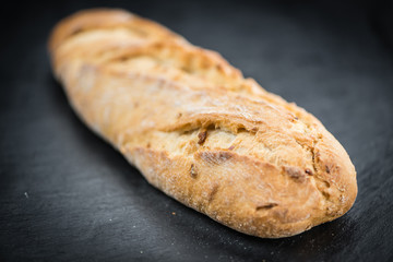 Baguette on a slate slab (selective focus)