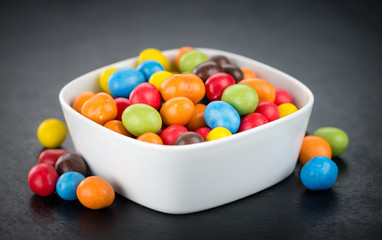 Cocolate coated Peanuts on a slate slab (selective focus)