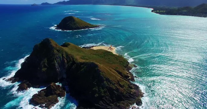 Two Remote Coastal Islands in the Pacific Ocean with a Small Beach Surrounded by Turquoise Blue Ocean Waters - Aerial Footage of Oahu, Hawaii