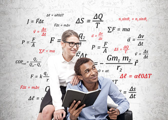 Fototapeta premium African man and blonde woman, physics formulas