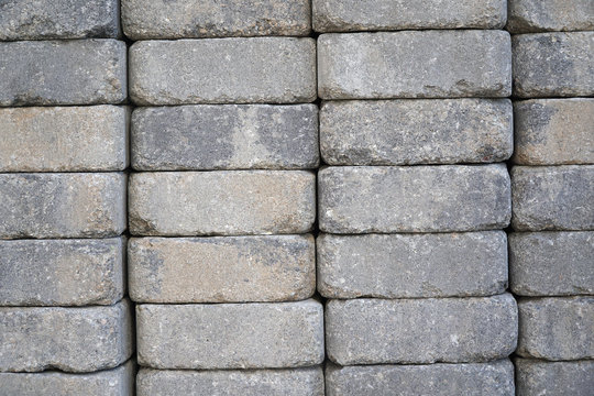 Fototapeta stacking grey bricks background