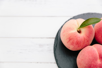 Fresh Japan White Peaches on Wooden White Background