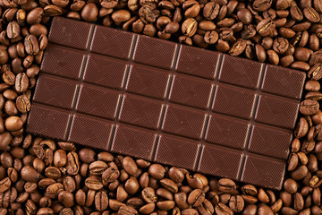 Dark chocolate and coffee beans close-up, top view