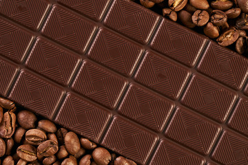 Dark chocolate and coffee beans close-up, top view