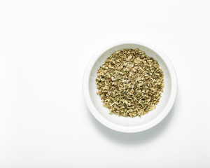 Bowl of dried oregano leaves