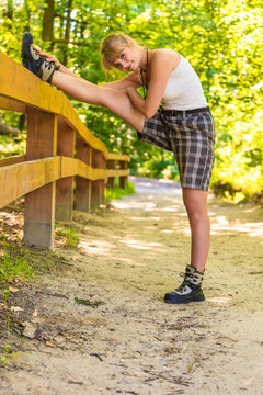 Hiker young woman in nature preparing to hike