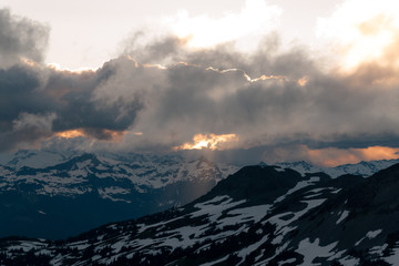 Fototapeta na wymiar Cloudy sunset in mountains above Garibaldi Lake on Panorama Ridge