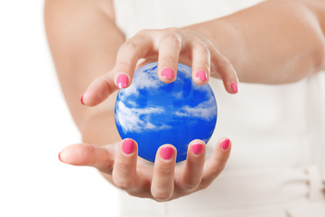 Two Woman Hands Protecting Blue Sky Sphere.